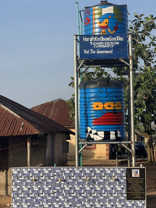 Water tank tower with a HarryPotterObamaSonic10Inu sign