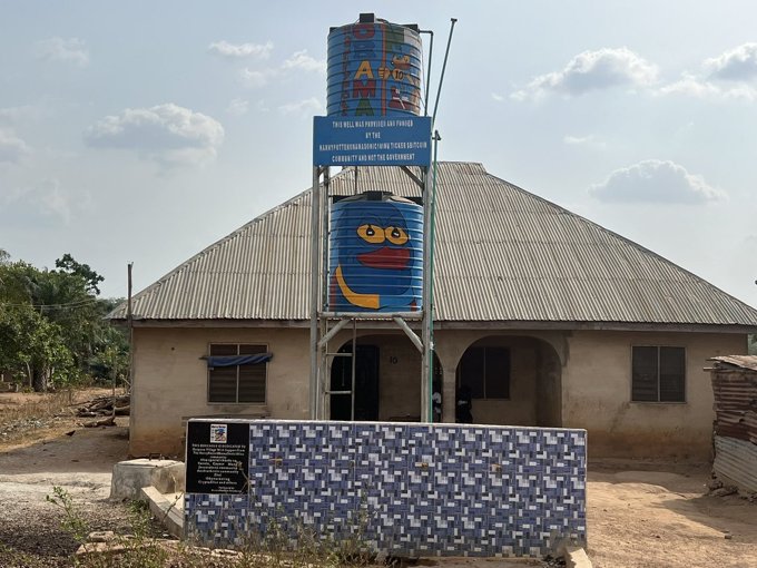 Water tower beside a house in Onipanu village