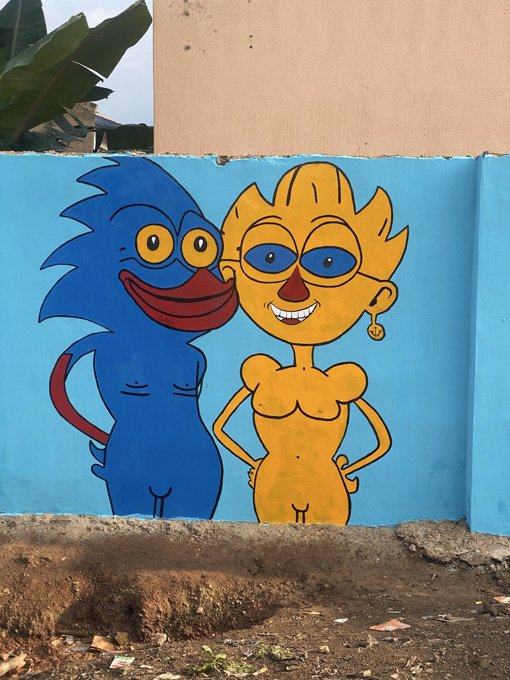 Two Sprotos painted side by side on a blue wall